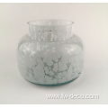green patterned glass candle holder